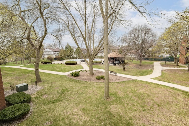 view of home's community with a gazebo and a yard