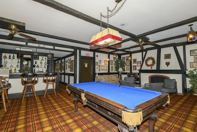 rec room with a ceiling fan, pool table, and beam ceiling
