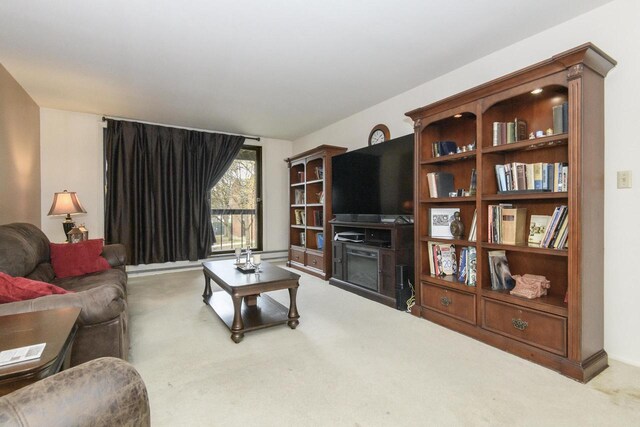 living room with carpet and a fireplace