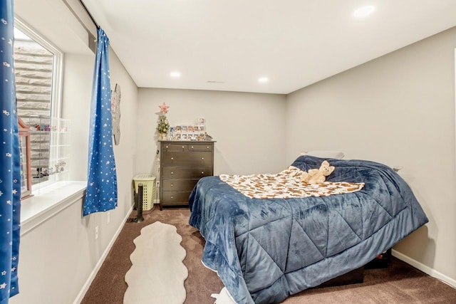 bedroom with baseboards, recessed lighting, and carpet
