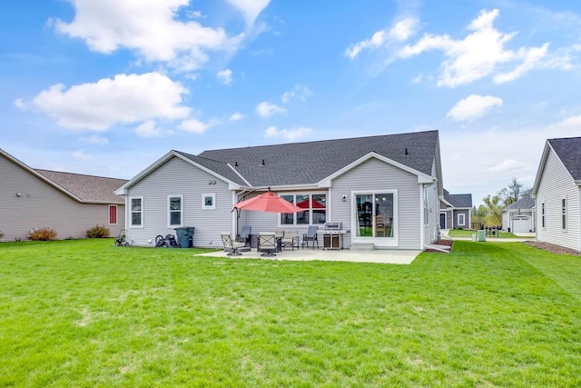 back of property with a lawn and a patio area
