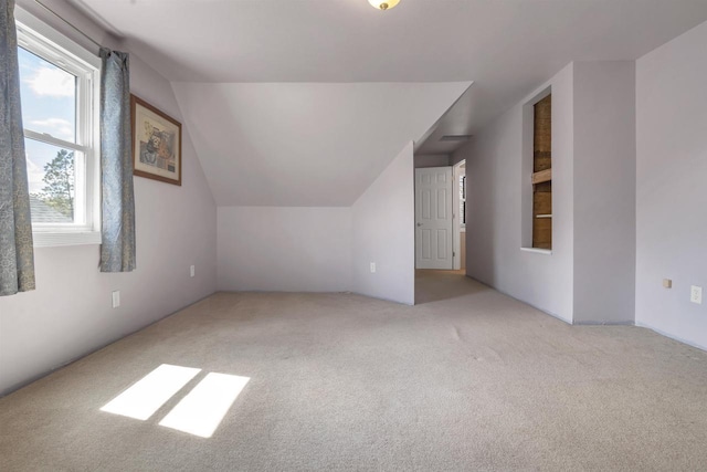 1112 Marquette Ave, Green Bay, WI 54304 - additional living space with carpet flooring and vaulted ceiling