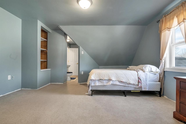 1112 Marquette Ave, Green Bay, WI 54304 - carpeted bedroom with baseboards and lofted ceiling