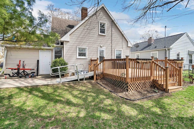 1112 Marquette Ave, Green Bay, WI 54304 - back of property with a yard, a chimney, a shingled roof, and a wooden deck
