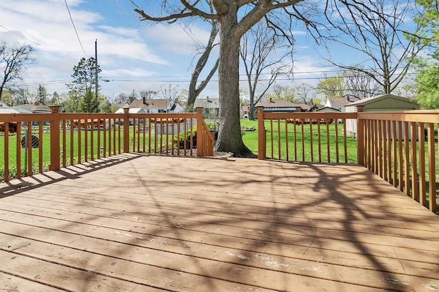 1112 Marquette Ave, Green Bay, WI 54304 - deck with a lawn and an outdoor structure