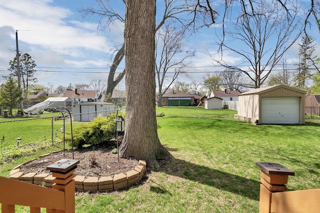 1112 Marquette Ave, Green Bay, WI 54304 - view of yard with an outdoor structure, a garage, and fence