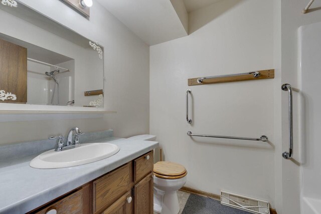8022 W Glenbrook Rd, Milwaukee, WI 53223 - bathroom with visible vents, walk in shower, toilet, and vanity