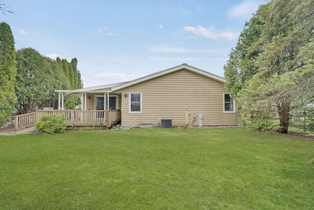 8022 W Glenbrook Rd, Milwaukee, WI 53223 - back of property with a yard, a deck, and cooling unit