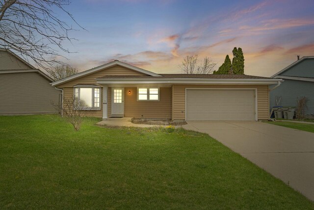 8022 W Glenbrook Rd, Milwaukee, WI 53223 - single story home with concrete driveway, an attached garage, and a front lawn