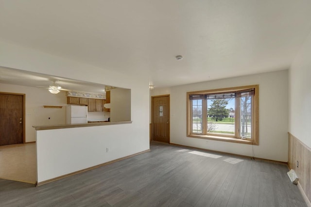 8022 W Glenbrook Rd, Milwaukee, WI 53223 - unfurnished living room with baseboards, ceiling fan, and wood finished floors