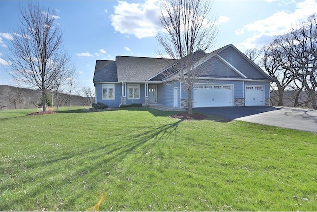 203 Walnut Hill Way, River Falls, WI 54022 - view of front of house with driveway, a garage, a front lawn, and stone siding