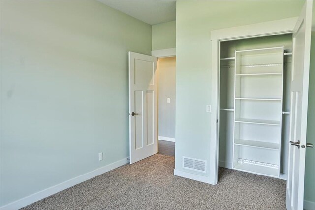 203 Walnut Hill Way, River Falls, WI 54022 - unfurnished bedroom featuring carpet, baseboards, and a closet