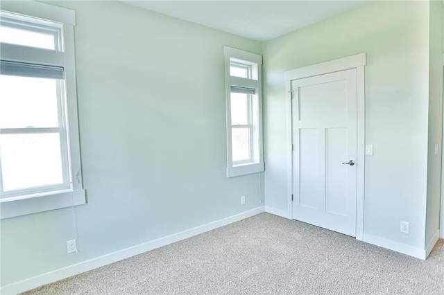 203 Walnut Hill Way, River Falls, WI 54022 - unfurnished bedroom with carpet flooring and baseboards