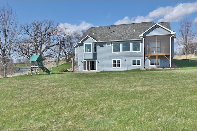 203 Walnut Hill Way, River Falls, WI 54022 - rear view of property featuring a lawn and a playground