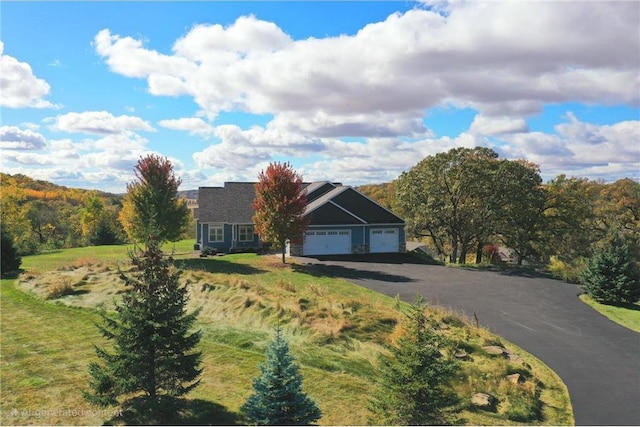 203 Walnut Hill Way, River Falls, WI 54022 - view of front of house featuring an attached garage and asphalt driveway