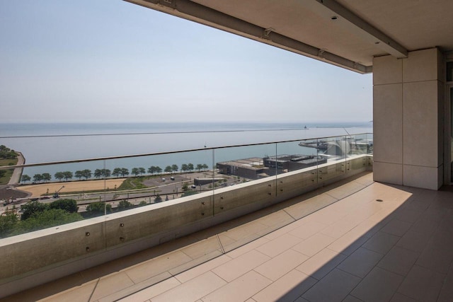 balcony featuring a water view