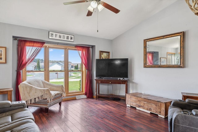 living area with visible vents, a ceiling fan, vaulted ceiling, and hardwood / wood-style flooring