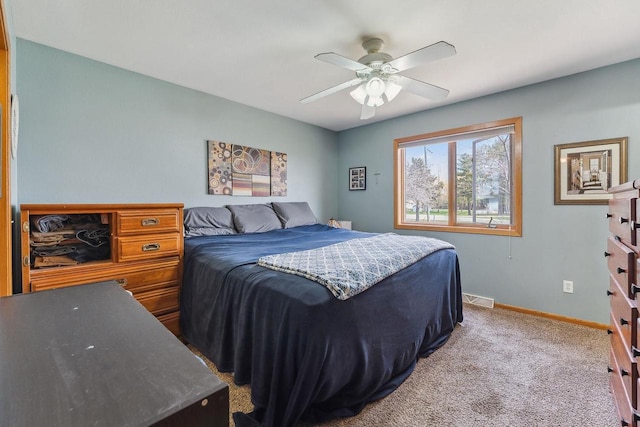 bedroom featuring baseboards, ceiling fan, carpet floors, and visible vents
