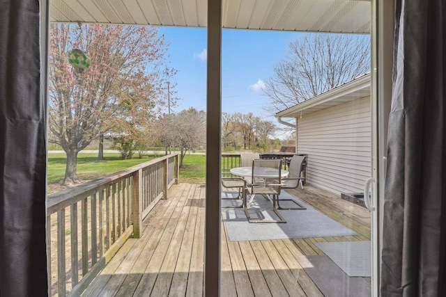 wooden deck with outdoor dining space