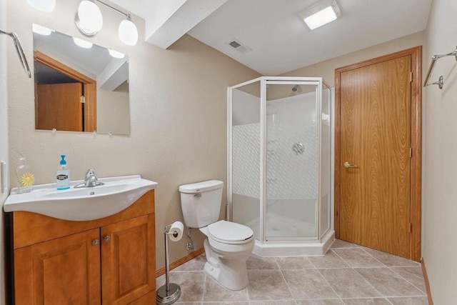 full bath with visible vents, a shower stall, vanity, tile patterned floors, and toilet