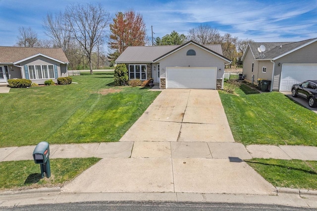 ranch-style home with an attached garage, driveway, stone siding, and a front yard