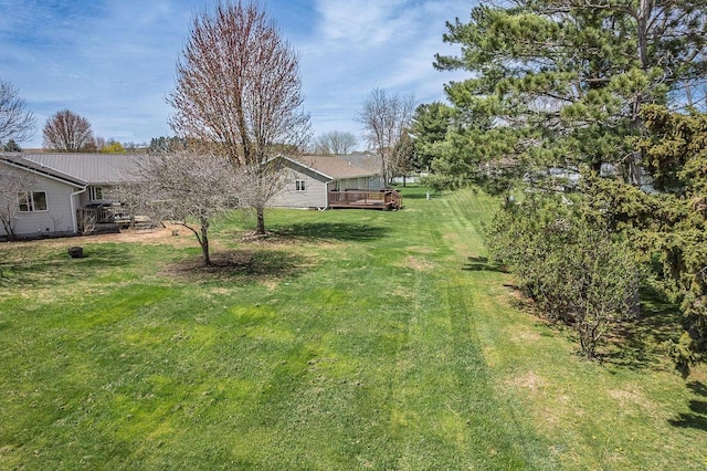 view of yard with a wooden deck