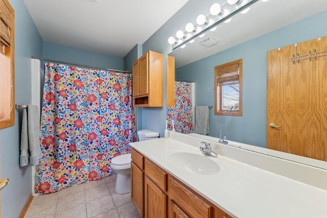 bathroom featuring visible vents, vanity, toilet, tile patterned floors, and a shower with curtain