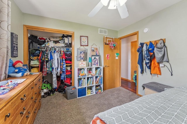 bedroom featuring a ceiling fan, carpet, a closet, and visible vents