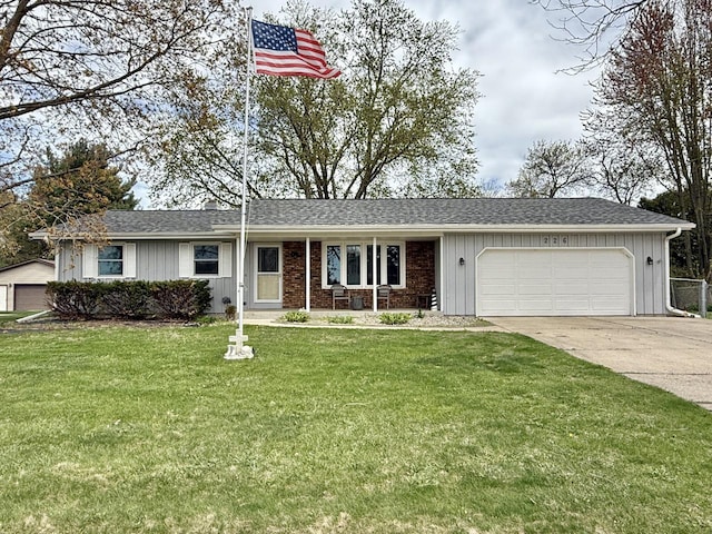226 Westridge Rd, Janesville, WI 53548 - ranch-style home featuring board and batten siding, driveway, a front yard, and a garage