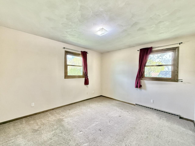 226 Westridge Rd, Janesville, WI 53548 - carpeted spare room featuring a textured ceiling, baseboards, and baseboard heating