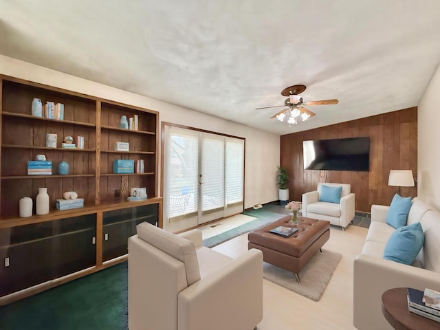 226 Westridge Rd, Janesville, WI 53548 - living room with ceiling fan and wooden walls