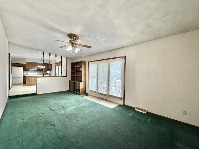 226 Westridge Rd, Janesville, WI 53548 - unfurnished living room with carpet floors, baseboards, a ceiling fan, and visible vents