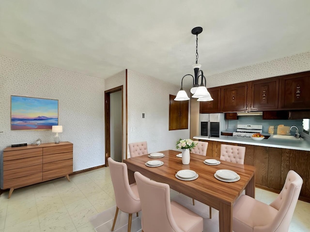226 Westridge Rd, Janesville, WI 53548 - dining space with light floors and wallpapered walls