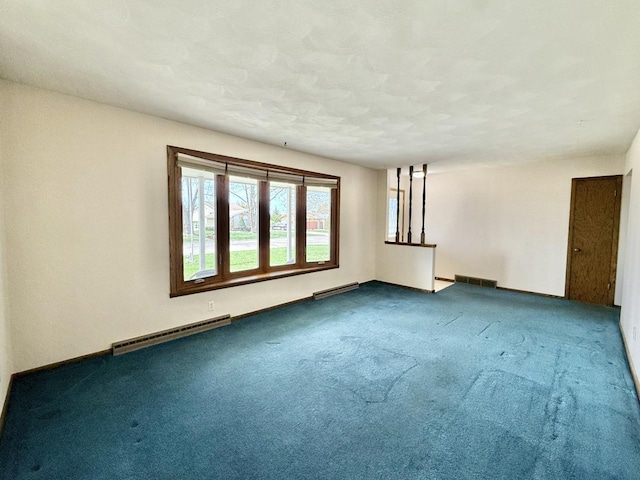 226 Westridge Rd, Janesville, WI 53548 - carpeted spare room with baseboards, baseboard heating, and visible vents