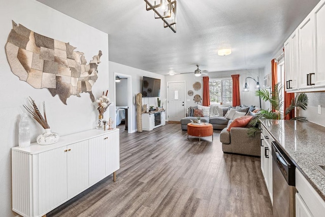 living room with ceiling fan and wood finished floors