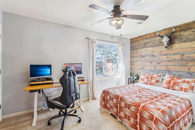 carpeted bedroom with baseboards and ceiling fan