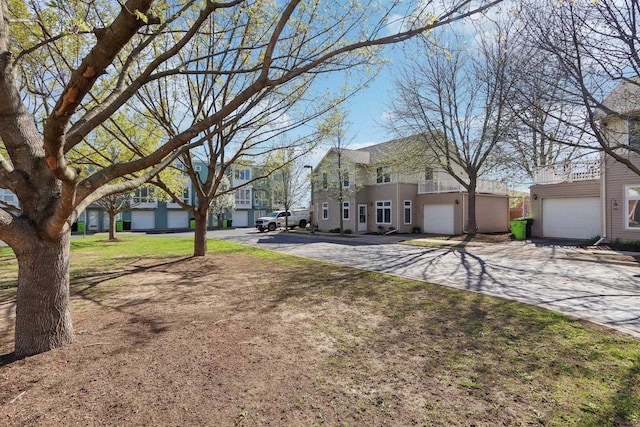 exterior space featuring driveway and a residential view