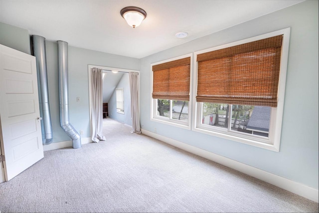 carpeted spare room with baseboards