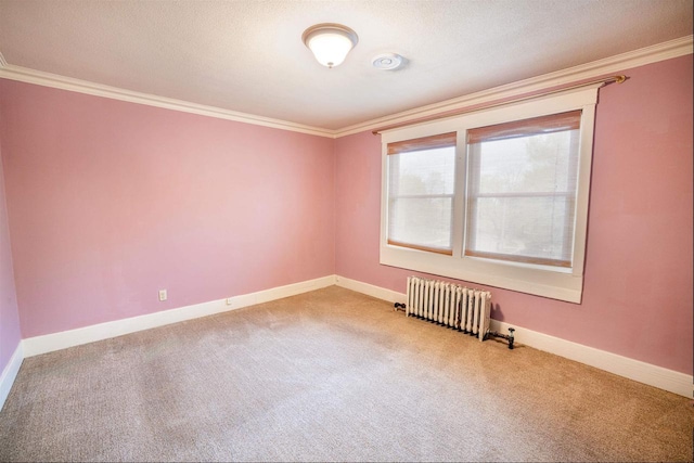 unfurnished room featuring carpet floors, ornamental molding, and radiator heating unit