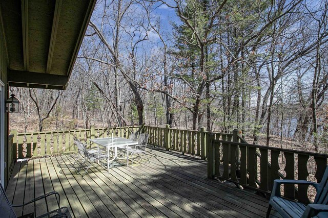 wooden deck with outdoor dining space