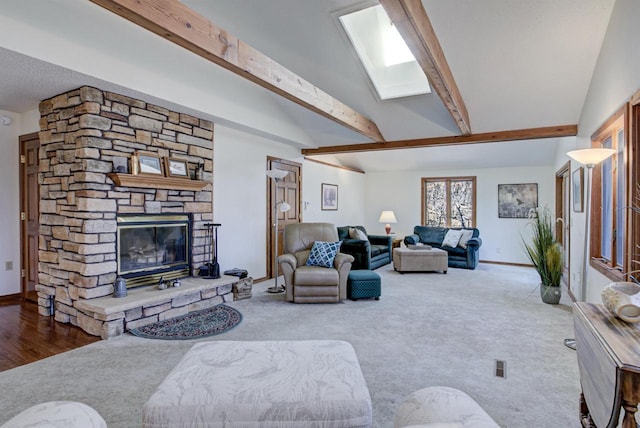 carpeted living area with a fireplace, baseboards, and lofted ceiling with beams