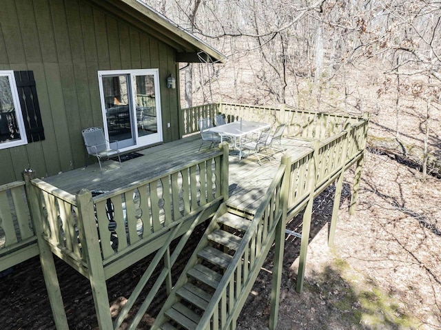 wooden terrace with outdoor dining area