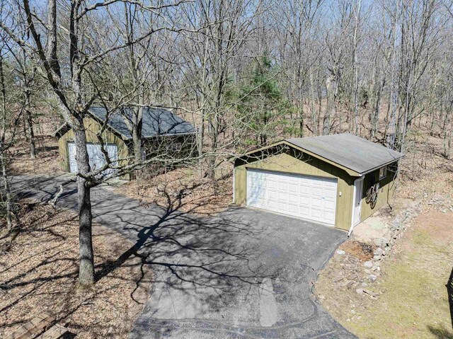 exterior space with a detached garage