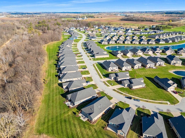 bird's eye view featuring a water view and a residential view