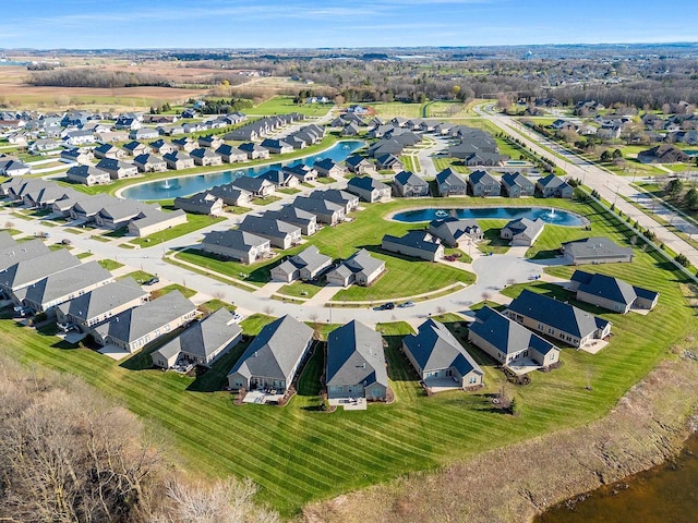 aerial view with a water view and a residential view