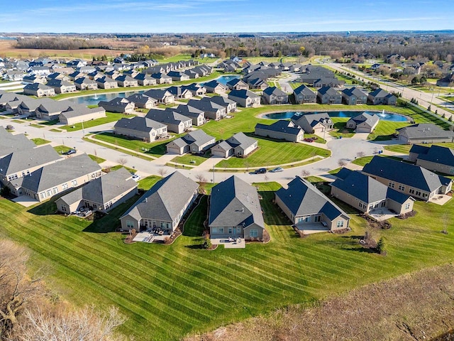 bird's eye view featuring a residential view and a water view