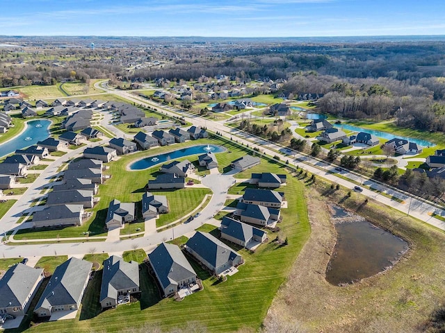 aerial view with a water view and a residential view