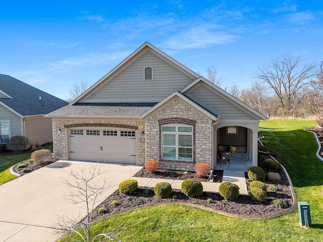 view of front facade with a shingled roof, an attached garage, a front lawn, stone siding, and driveway
