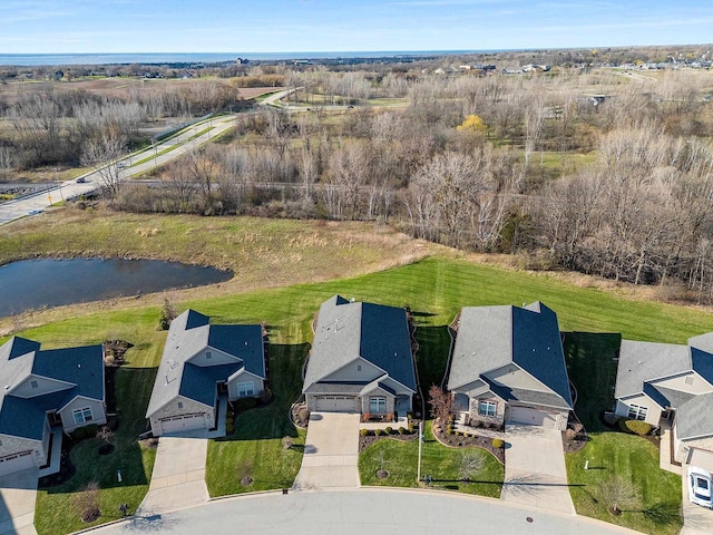 birds eye view of property with a water view and a residential view