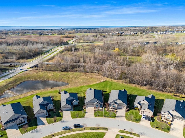 bird's eye view with a water view and a residential view